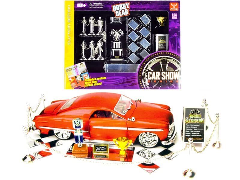 Vintage Car Show Collectible Set with Accessories and Display Stand Vintage car show collectible set with miniature car, trophies, and accessories for display and play.