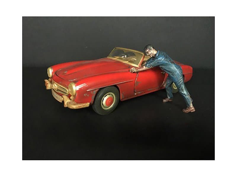 Vintage Red Convertible Car Collectible with Man Figurine Vintage red convertible car figurine with detailed man figure pushing the car. Perfect for classic c.
