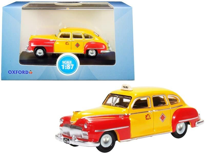 Taxi Cab Diecast Model Car - 1:87 Scale Taxi cab diecast model car in yellow and red, detailed miniature collectible for car enthusiasts.