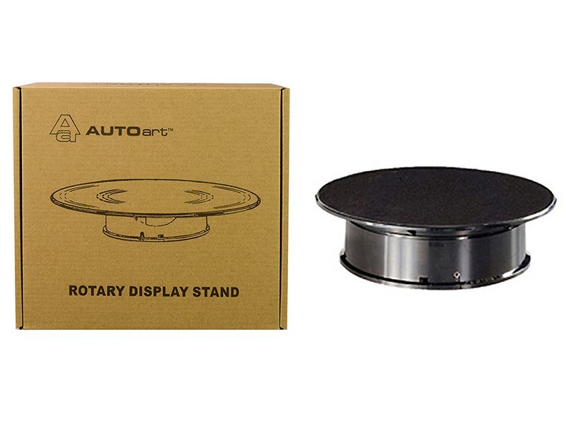 Rotary Display Stand for Collectibles Rotary display stand for collectibles, with a black circular top and metal base, ideal for showcasin.