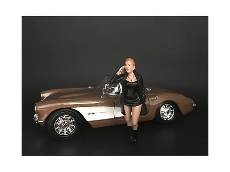 Vintage Car Collectible with Woman Figurine Vintage car collectible featuring a detailed miniature model of a classic convertible.