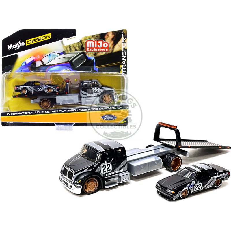 international durastar flatbed truck #22 and 1988 ford mustang lx #22 matt black with gray graphics "toyo tires" "elite transport" series 1/64 diecast models by maisto