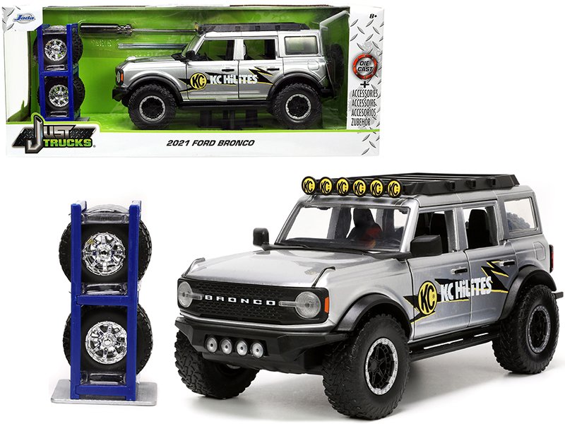 2021 ford bronco gray metallic "kc hilites" with extra wheels "just trucks" series 1/24 diecast model car by jada 2021 ford bronco gray metallic "kc hilites" with extra wheels "just trucks" series 1/24 diecast model car by jada