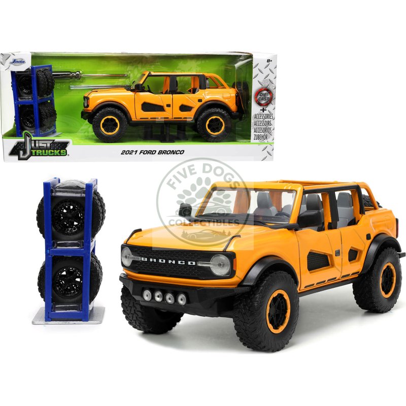 2021 ford bronco orange metallic with extra wheels "just trucks" series 1/24 diecast model car by jada
