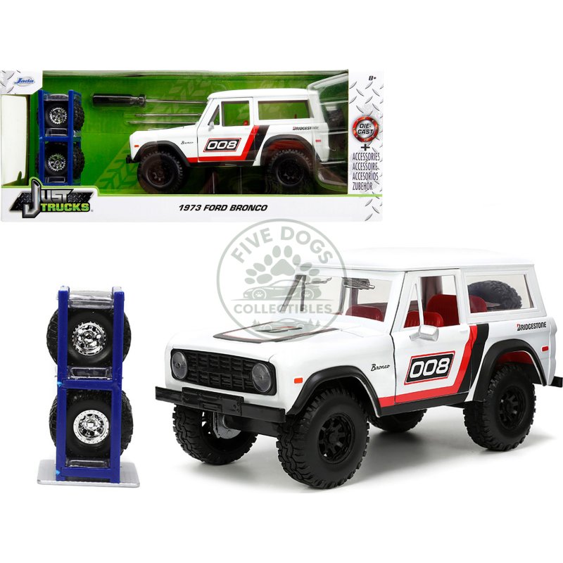 1973 ford bronco #008 white with red and black stripes and red interior with extra wheels "just trucks" series 1/24 diecast model car by jada