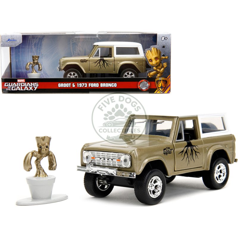 1973 ford bronco gold metallic with white top and groot diecast figure "guardians of the galaxy" "marvel" series 1/32 diecast model car by jada