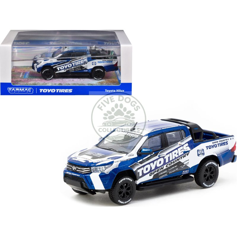 toyota hilux pickup truck rhd (right hand drive) "toyo tires" white and blue with graphics "hobby64" series 1/64 diecast model car by tarmac works