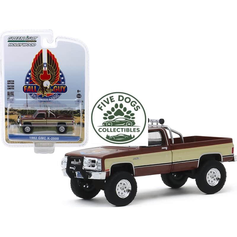 Diecast GMC K-2500 truck model with Fall Guy logo packaging, detailed collectible toy for enthusiast.