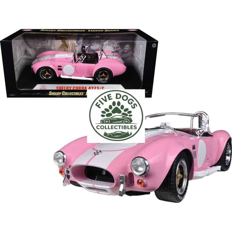 Shelby Cobra 427 S/C diecast car in pink with white racing stripe, detailed collectible toy.