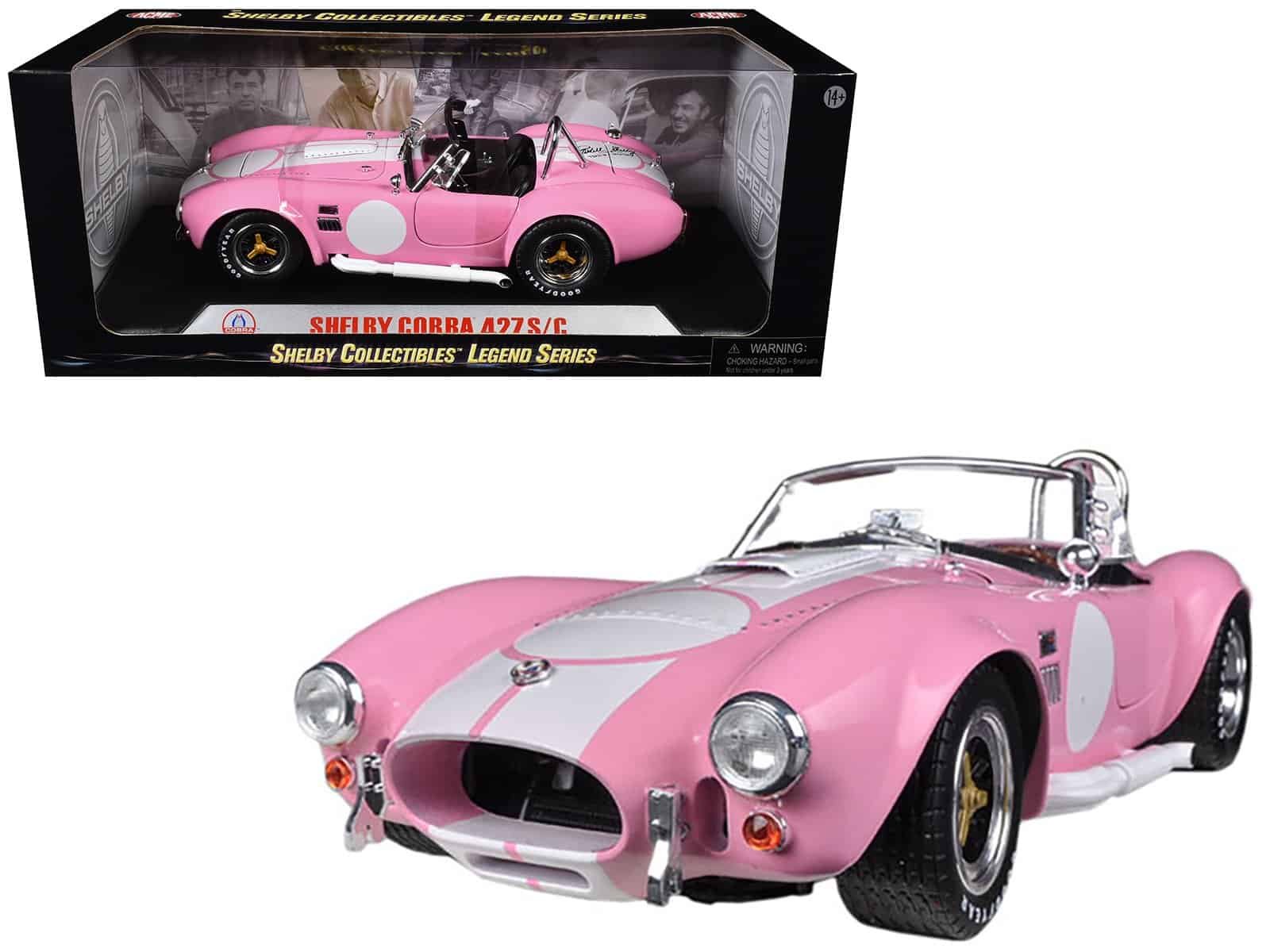 Shelby Cobra 427 S/C diecast model Shelby Cobra 427 S/C diecast car in pink with white racing stripe, detailed collectible toy.